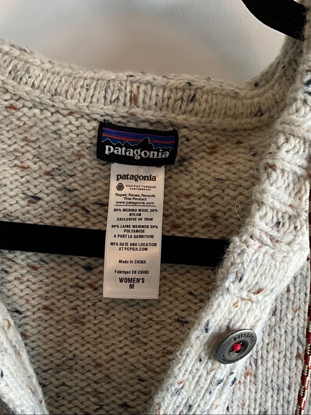 Patagonia women's V-Neck Hooded Sweater in Oatmeal Speckle with Navy Trim - Picture 2 of 3